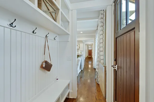 a view of an entryway with wooden floor