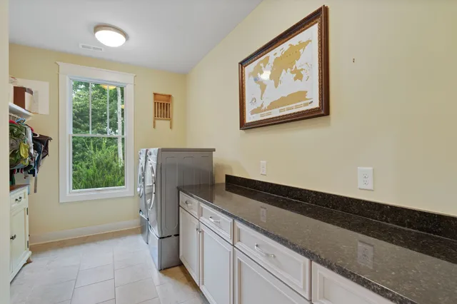 a kitchen with a refrigerator and a window