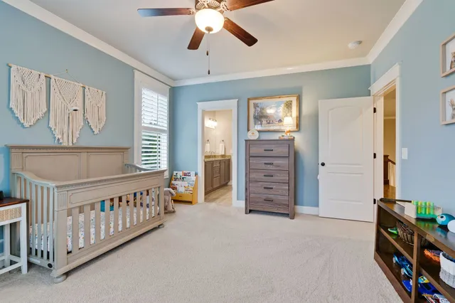 a view of a bedroom with furniture and staircase