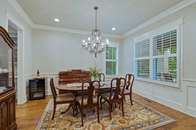 a view of a dining room with furniture and window