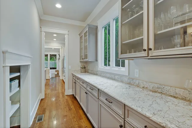 a spacious bathroom with a sink and a mirror