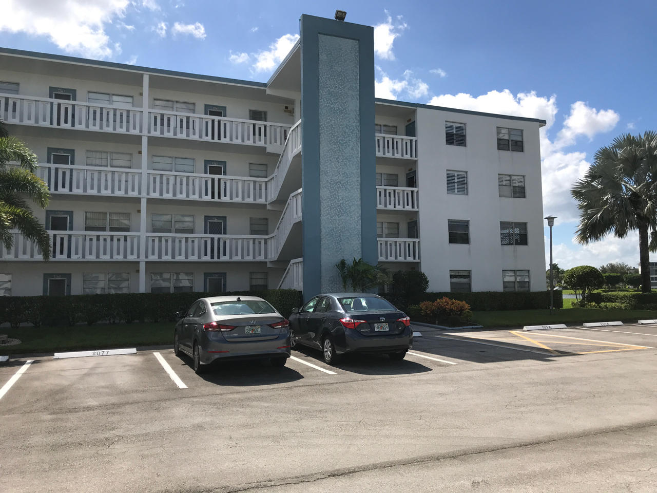 2073 Exeter, Unit E Boca Raton, FL 33434 - Photo 22 of 27 a car parked in front of a building
