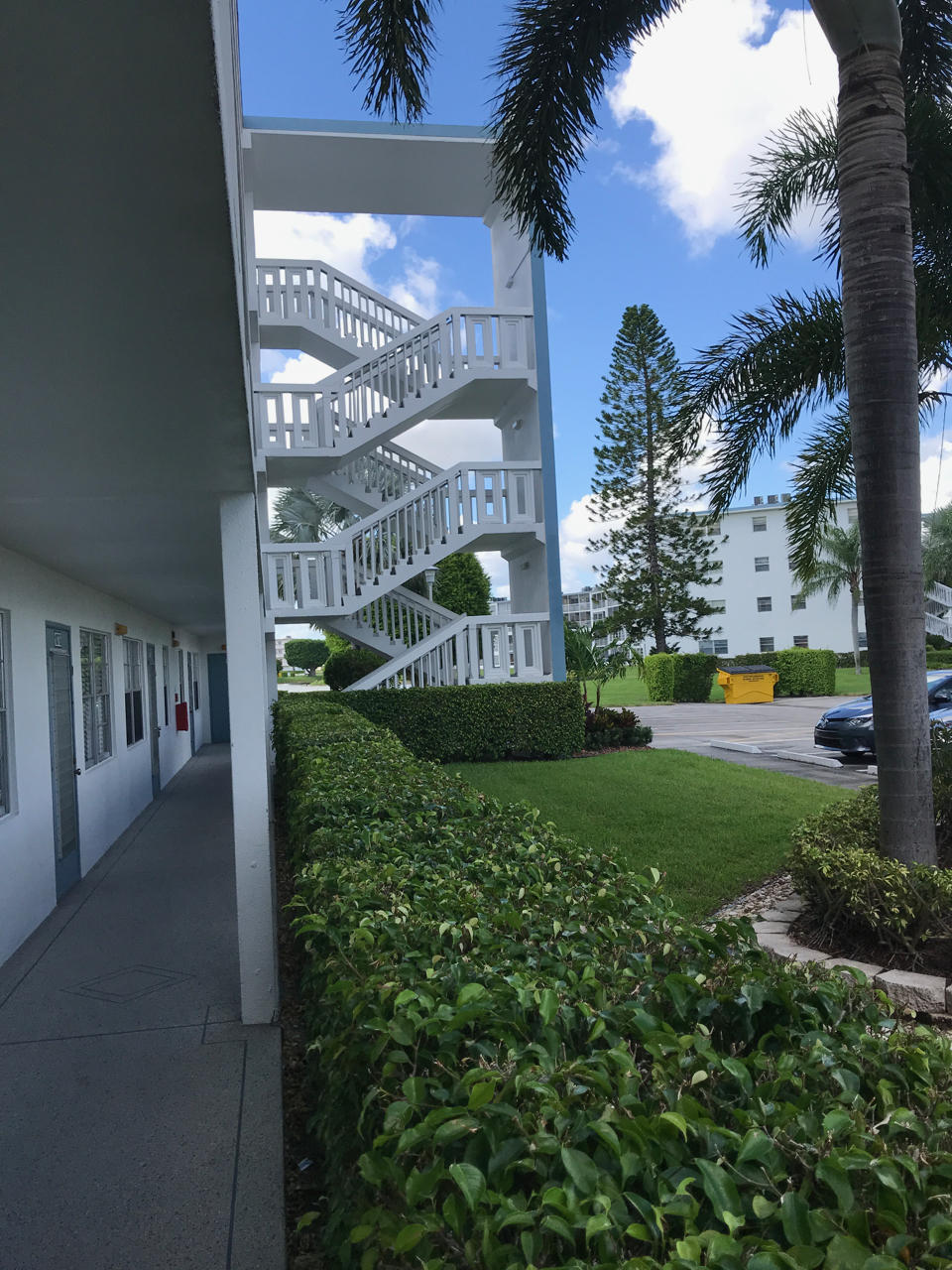 2073 Exeter, Unit E Boca Raton, FL 33434 - Photo 23 of 27 a view of a building in the background