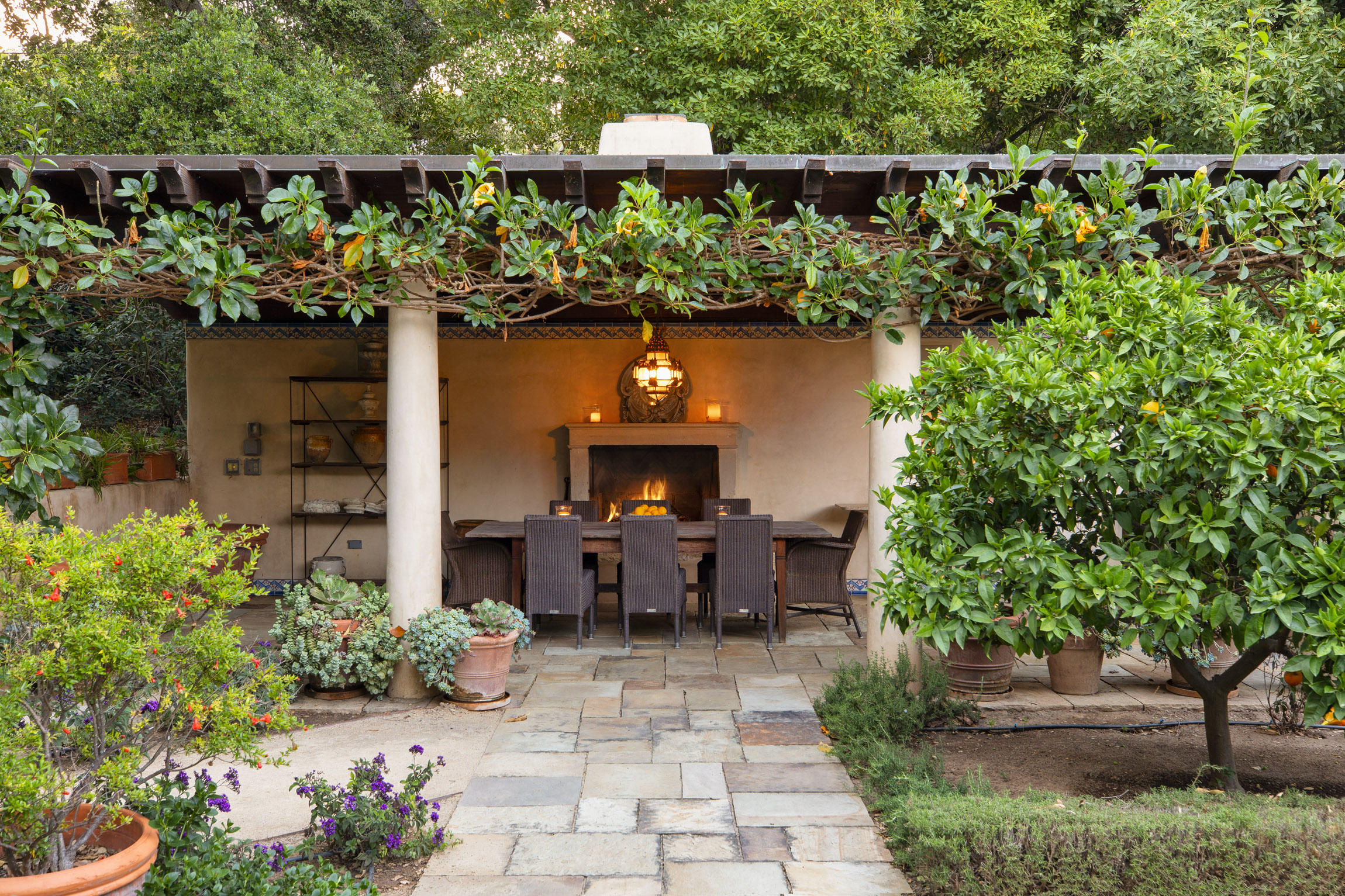 854 Rockbridge Road Santa Barbara, CA 93108 - Photo 22 of 34 a view of a chair and tables in the patio next to a yard