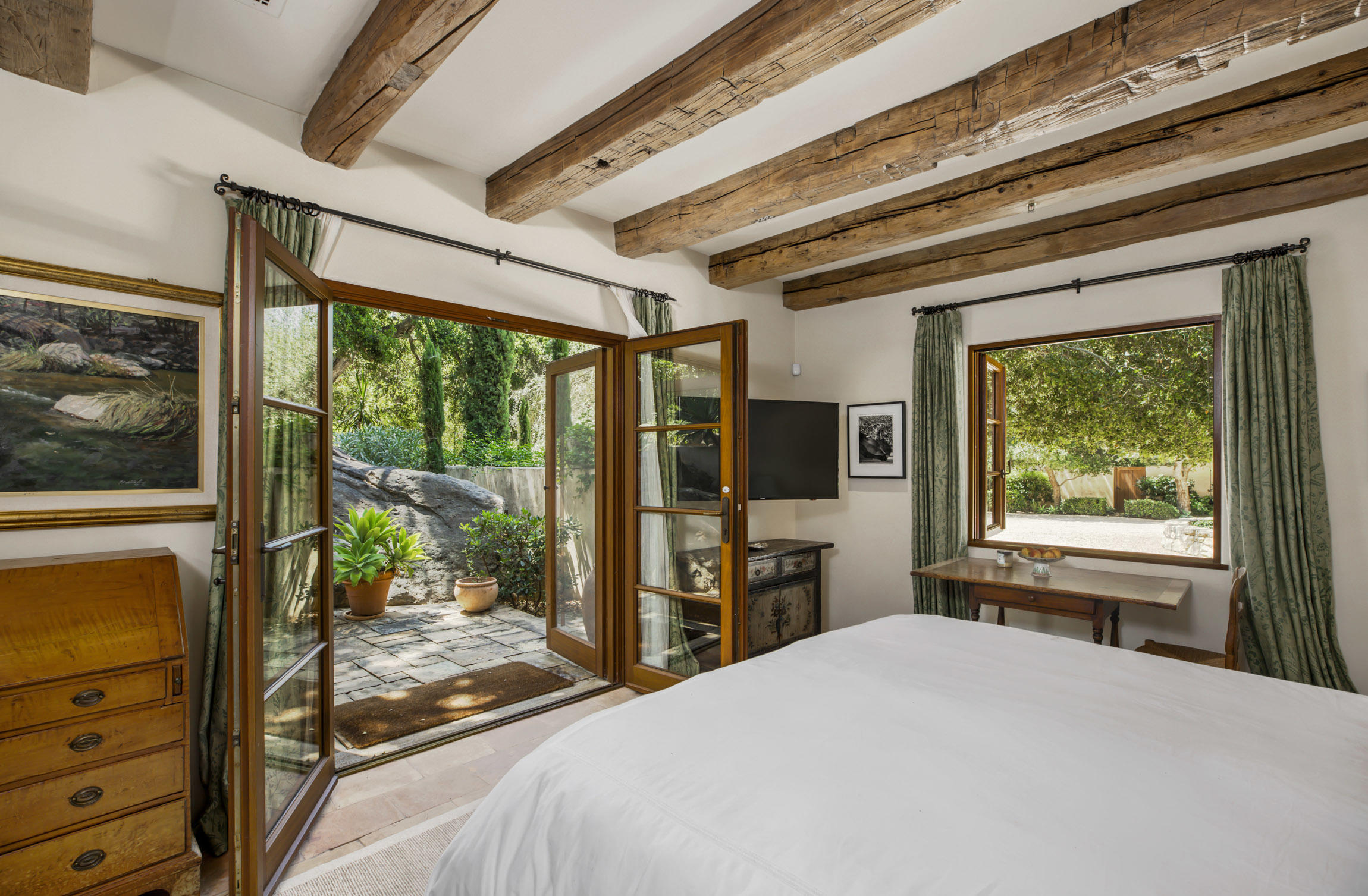 854 Rockbridge Road Santa Barbara, CA 93108 - Photo 25 of 34 a bedroom with a bed and large windows