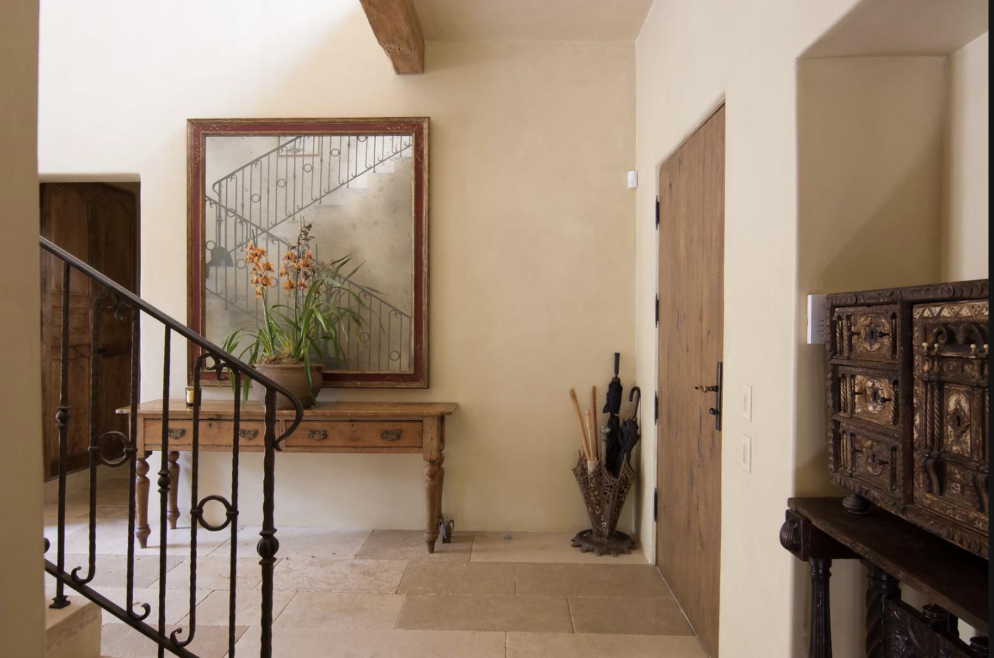 854 Rockbridge Road Santa Barbara, CA 93108 - Photo 7 of 34 a view of a hallway with wooden floor and staircase