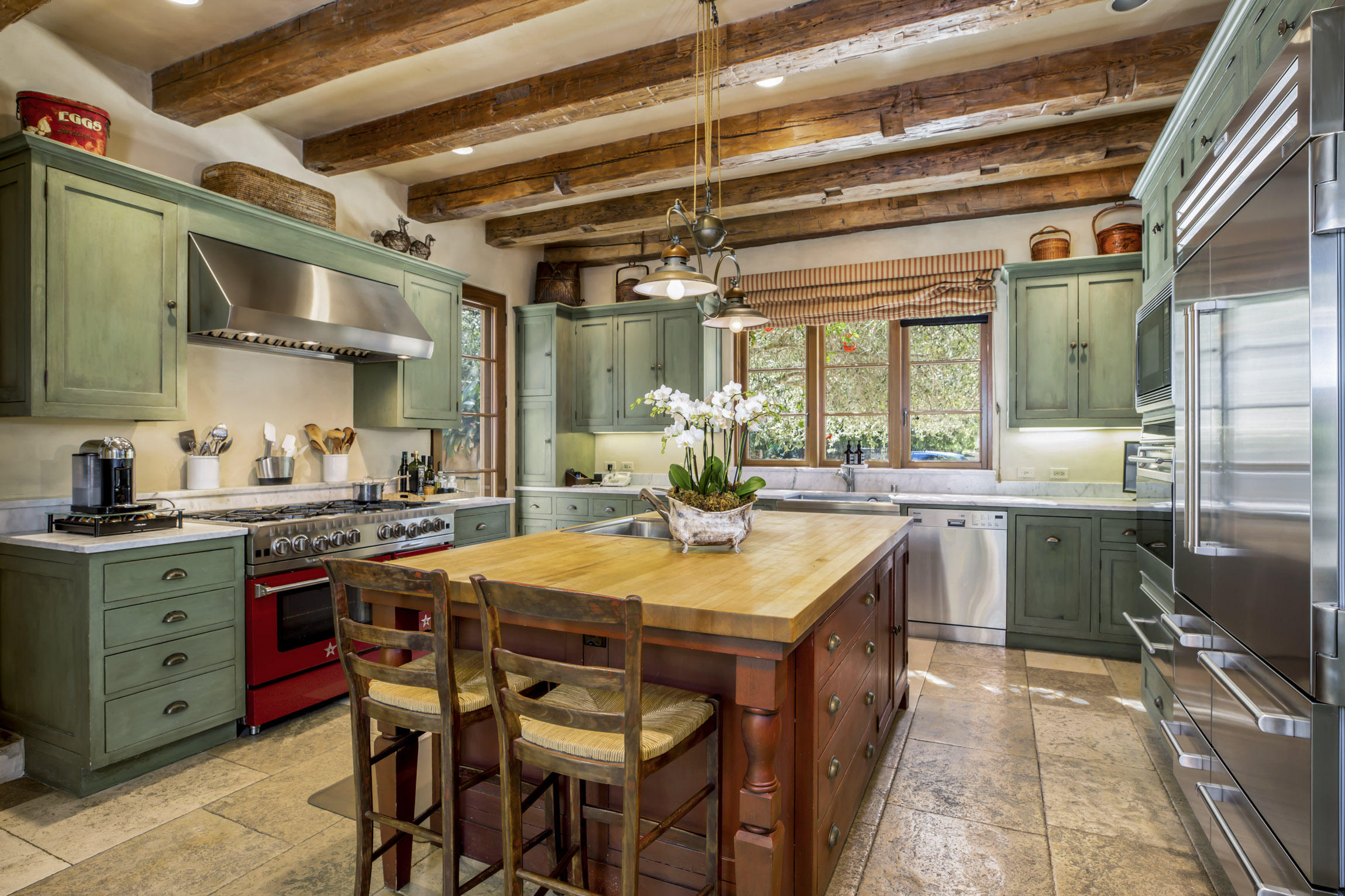 854 Rockbridge Road Santa Barbara, CA 93108 - Photo 9 of 34 a kitchen with a table and chairs in it