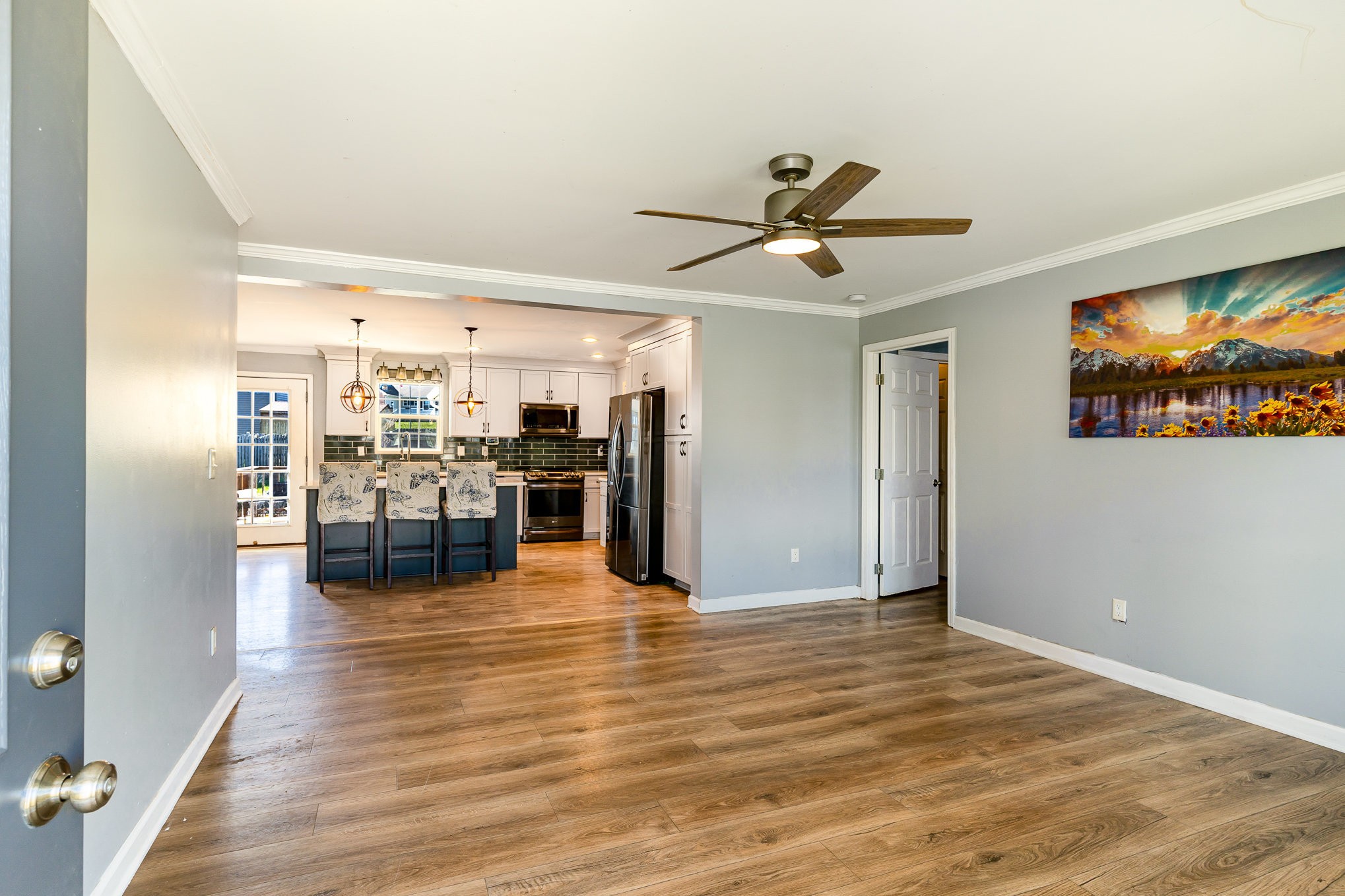 1159 Wrights Mill Road Spring Hill, TN 37174 - Photo 3 of 16 a view of a livingroom with furniture a ceiling fan and wooden floor