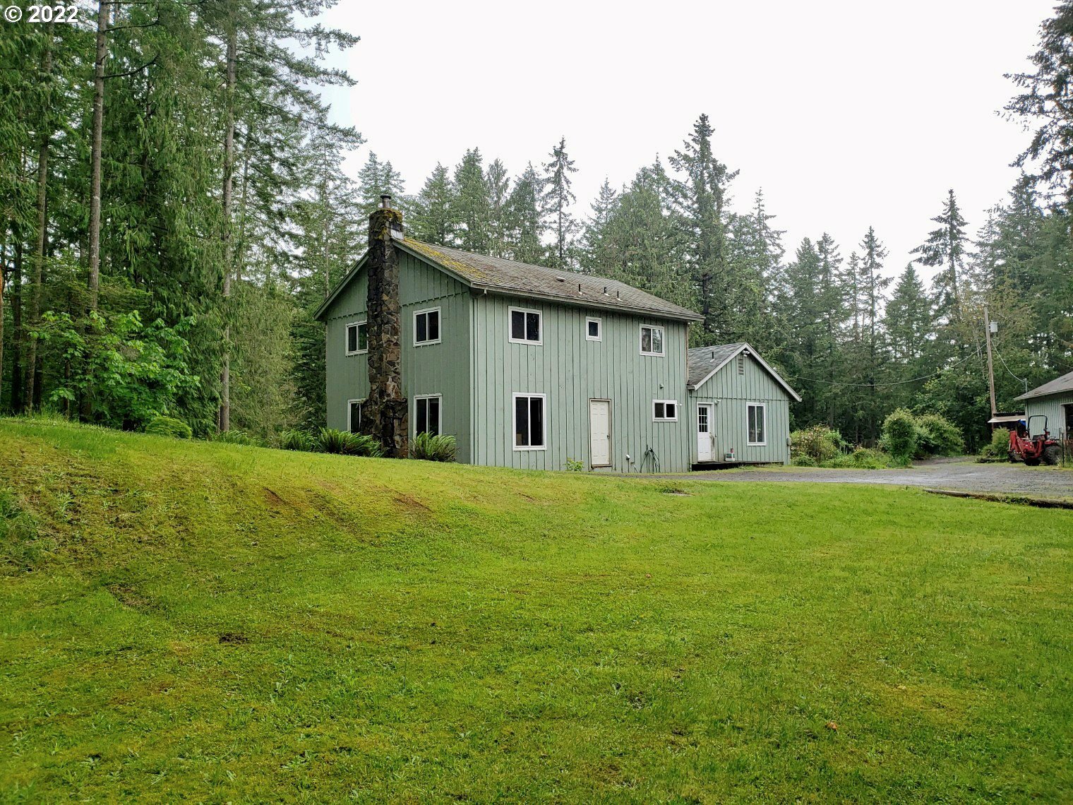 35995 South Wilhoit Road Molalla, OR 97038 - Photo 1 of 17 a view of a house with backyard and garden
