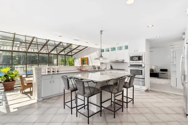a kitchen with a table and chairs in it