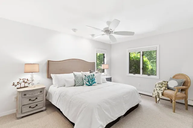 a bedroom with a bed and a chair