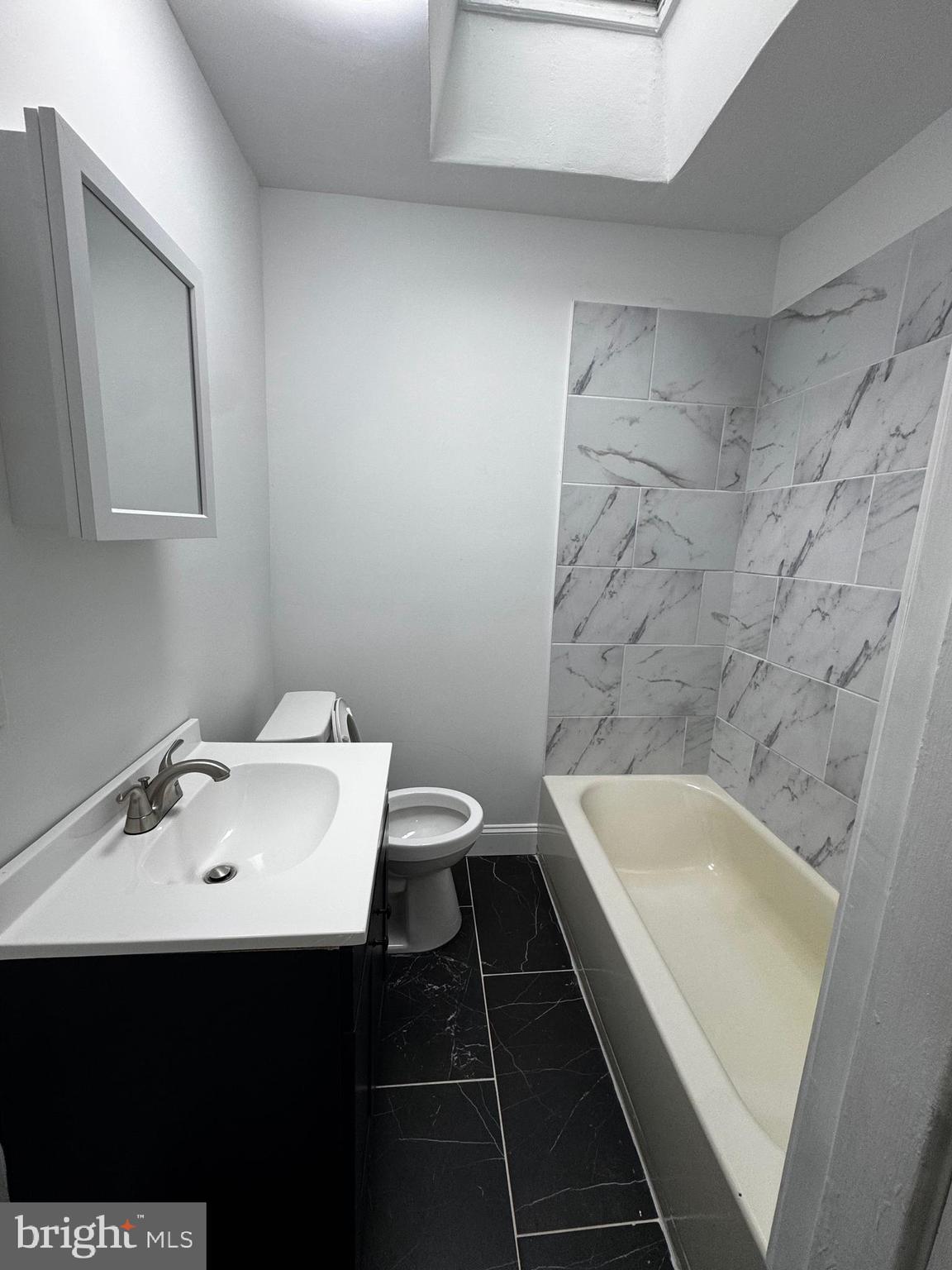 2656 Shields Street Philadelphia, PA 19142 - Photo 12 of 15 a bathroom with a sink and a bathtub