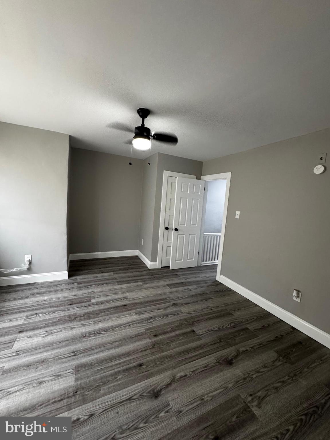 2656 Shields Street Philadelphia, PA 19142 - Photo 7 of 15 a view of an empty room with wooden floor and window