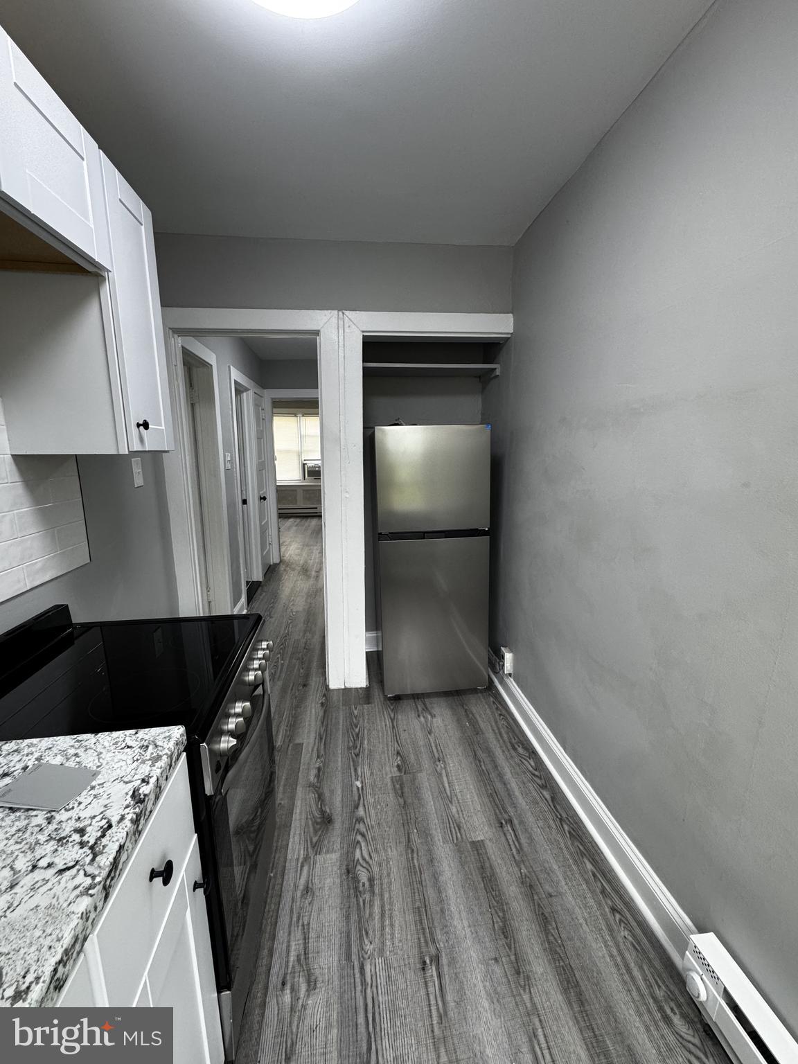 2656 Shields Street Philadelphia, PA 19142 - Photo 9 of 15 a walk in closet with wooden floor