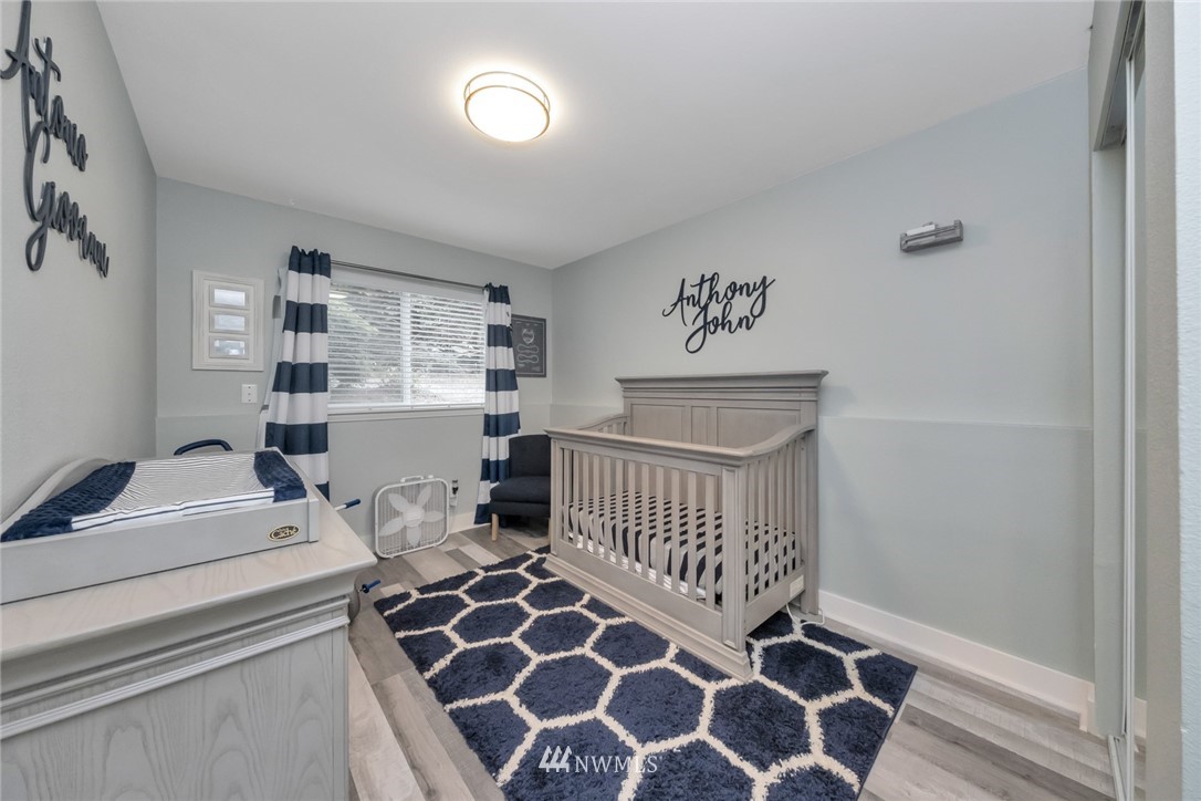 455 Newport Way Northwest, Unit 302 Issaquah, WA 98027 - Photo 12 of 17 a bedroom with furniture and windows