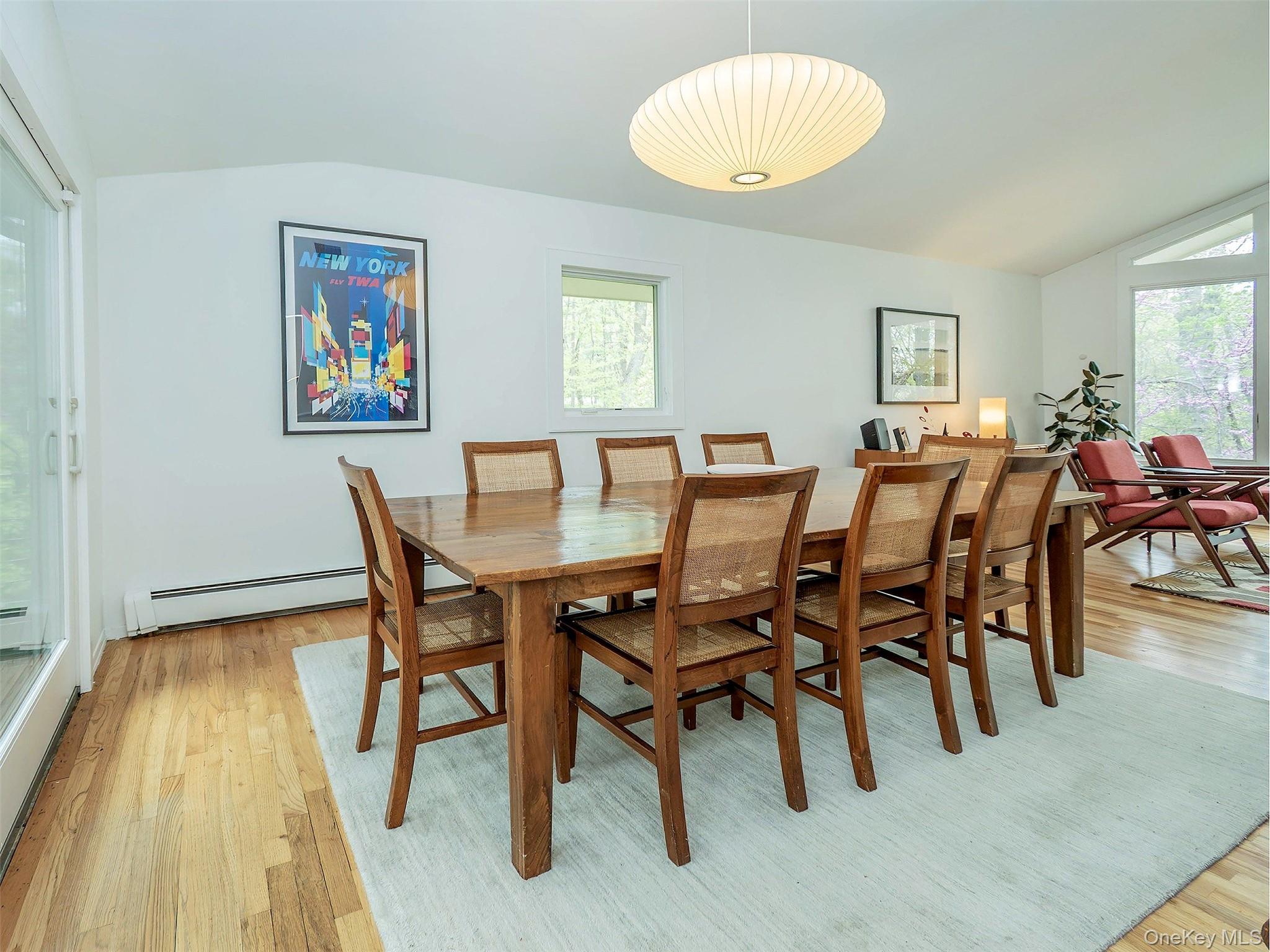 7 SE Road Sands Point, NY 11050 - Photo 12 of 45 a view of a dining room with furniture and wooden floor