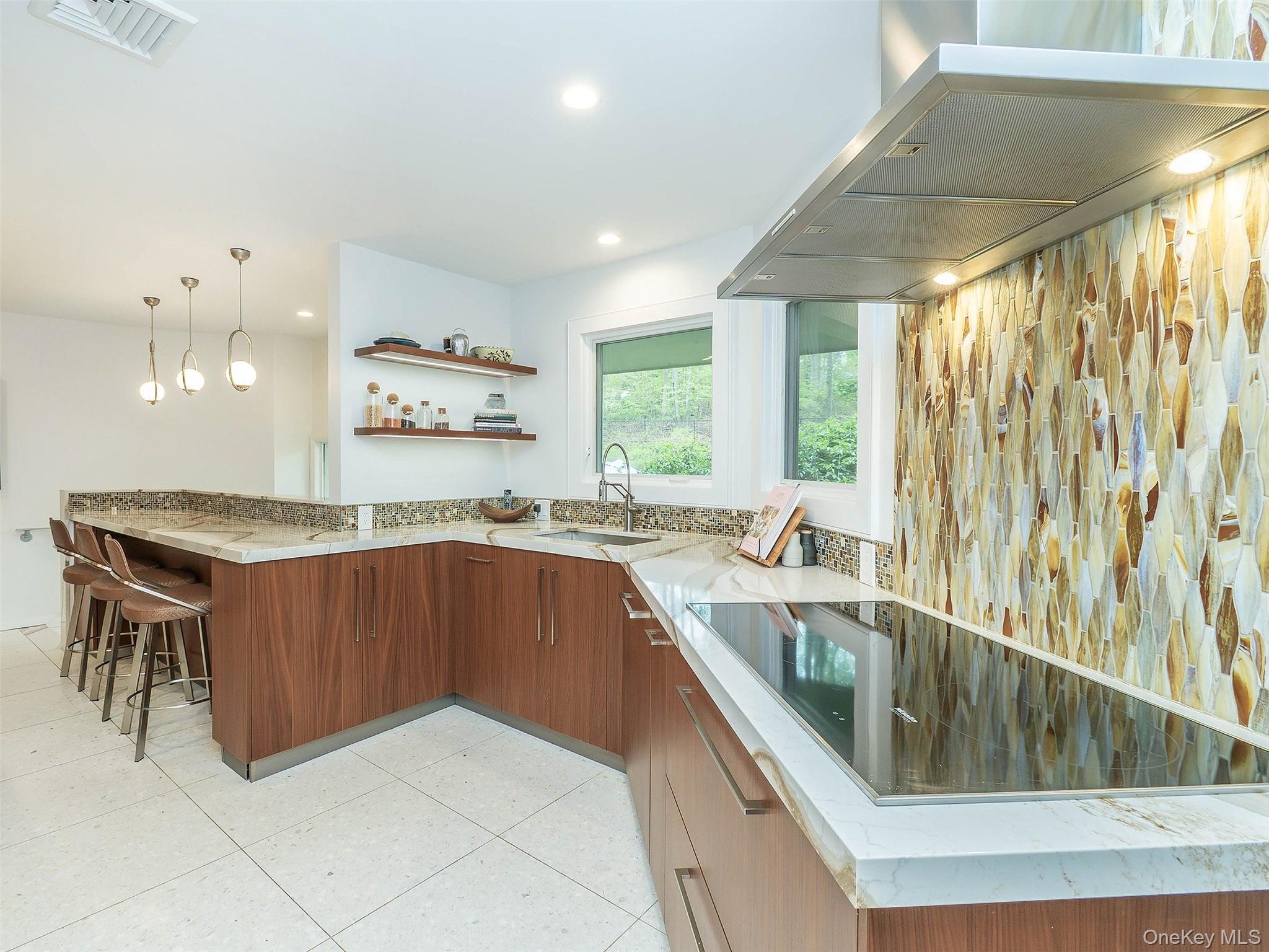 7 SE Road Sands Point, NY 11050 - Photo 15 of 45 a kitchen with stainless steel appliances granite countertop a sink and a stove
