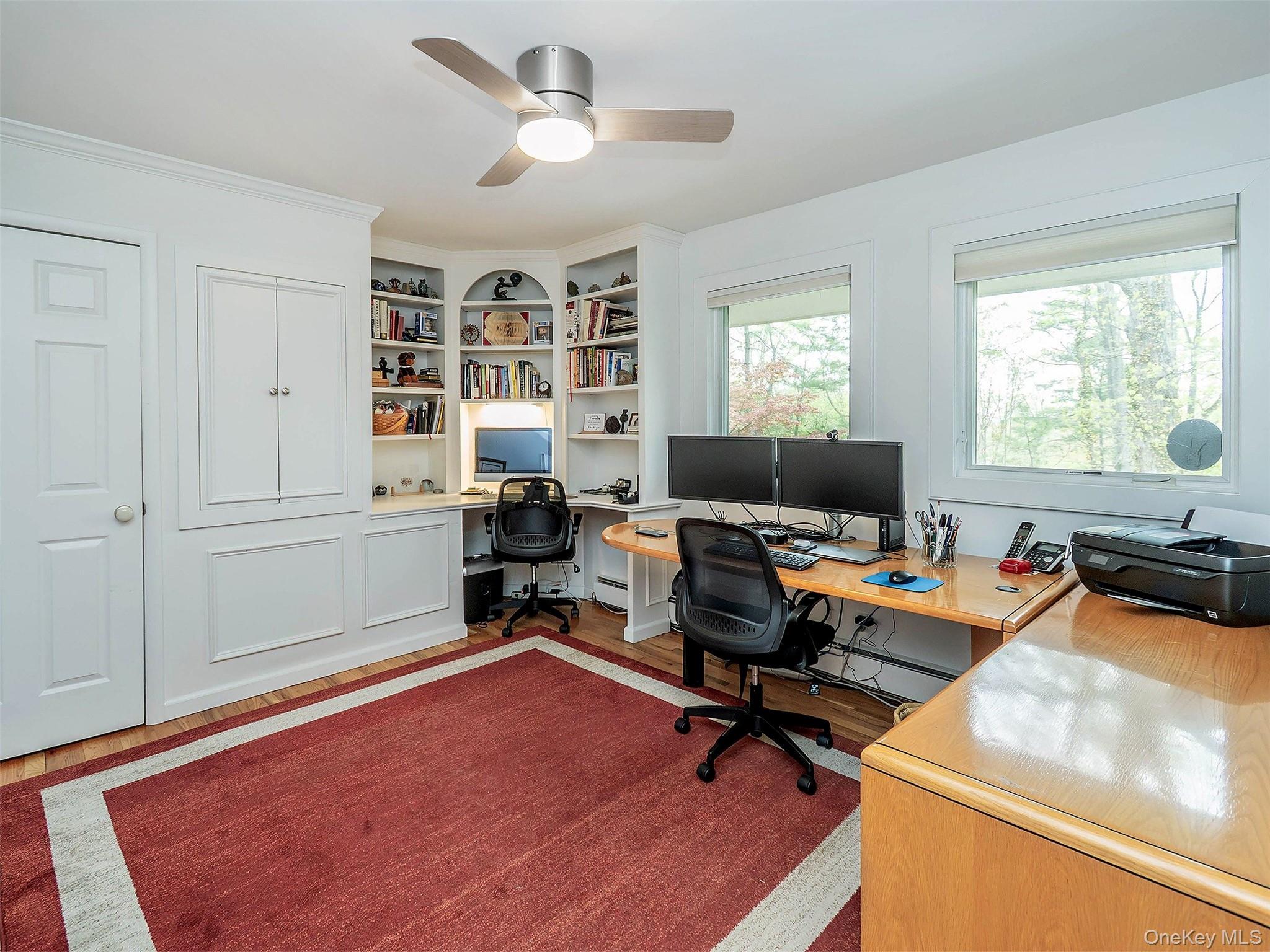 7 SE Road Sands Point, NY 11050 - Photo 25 of 45 a view of a workspace with furniture and a window
