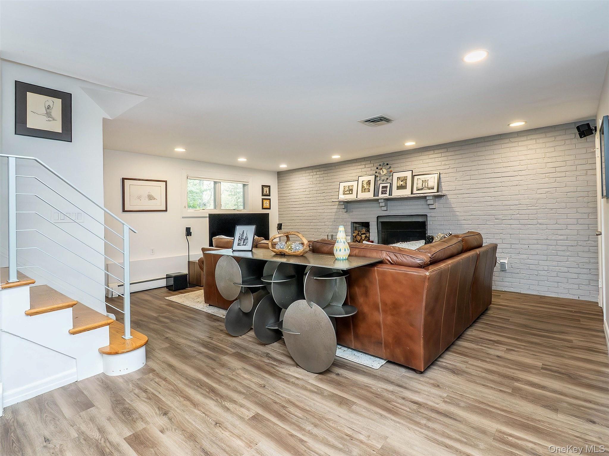 7 SE Road Sands Point, NY 11050 - Photo 27 of 45 a living room with furniture and a fireplace