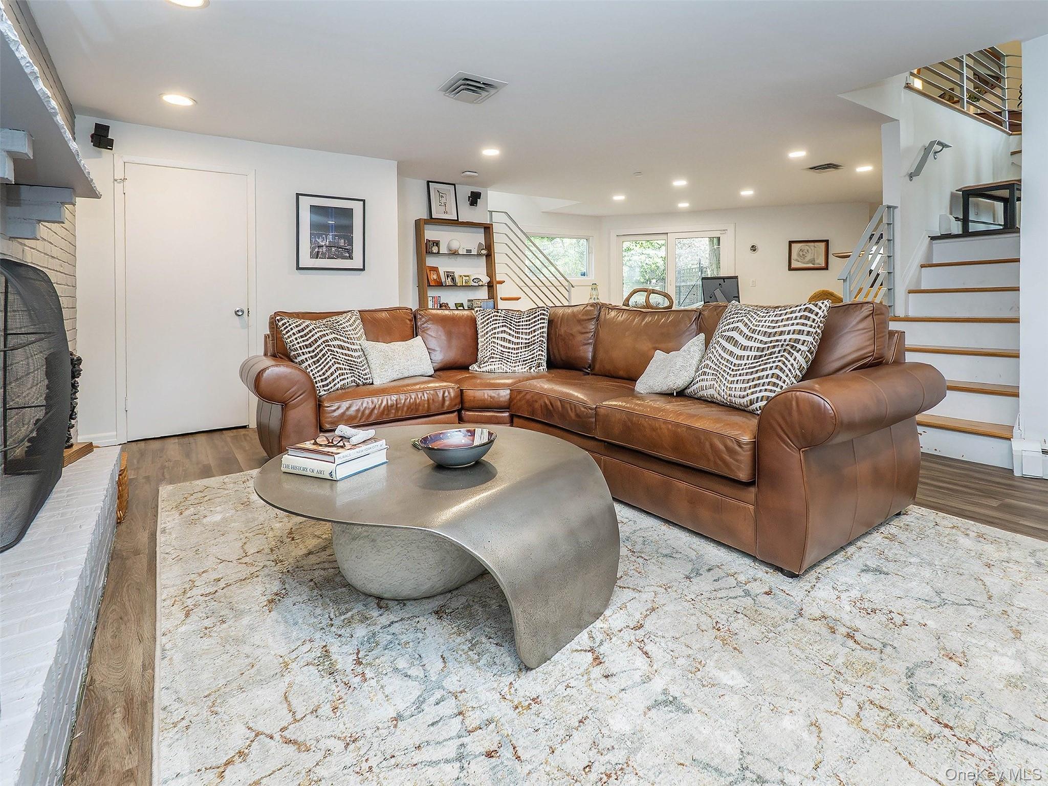 7 SE Road Sands Point, NY 11050 - Photo 29 of 45 a living room with furniture and a couch