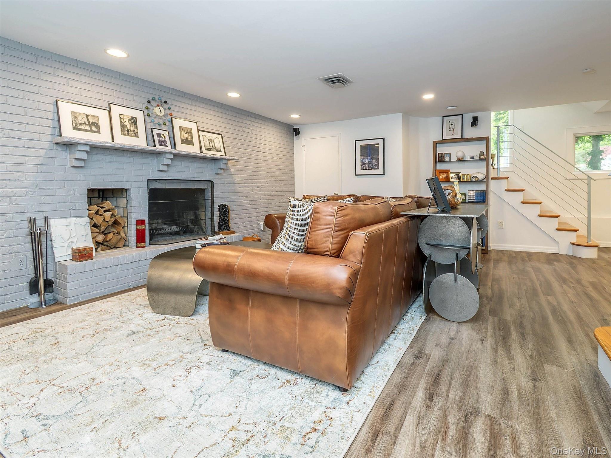 7 SE Road Sands Point, NY 11050 - Photo 30 of 45 a living room with furniture and a fireplace