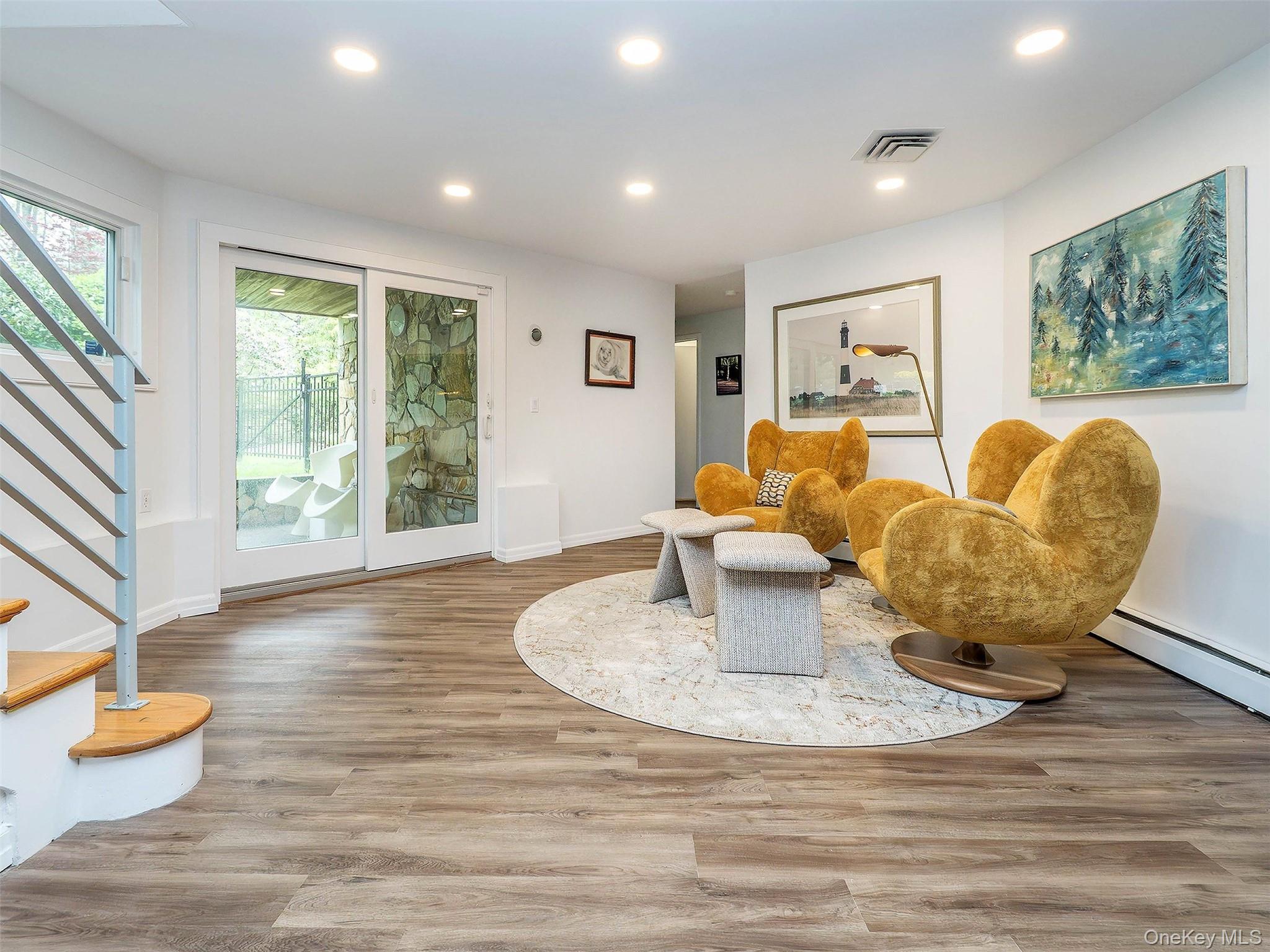 7 SE Road Sands Point, NY 11050 - Photo 32 of 45 a living room with furniture and a large window