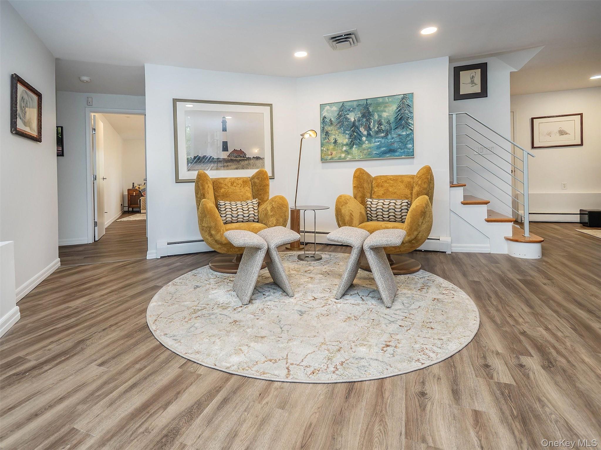 7 SE Road Sands Point, NY 11050 - Photo 33 of 45 a living room with furniture and a wooden floor