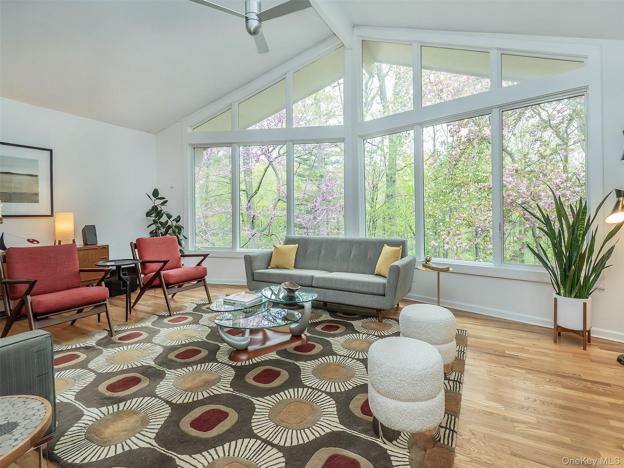 7 SE Road Sands Point, NY 11050 - Photo 9 of 45 a living room with furniture and a large window