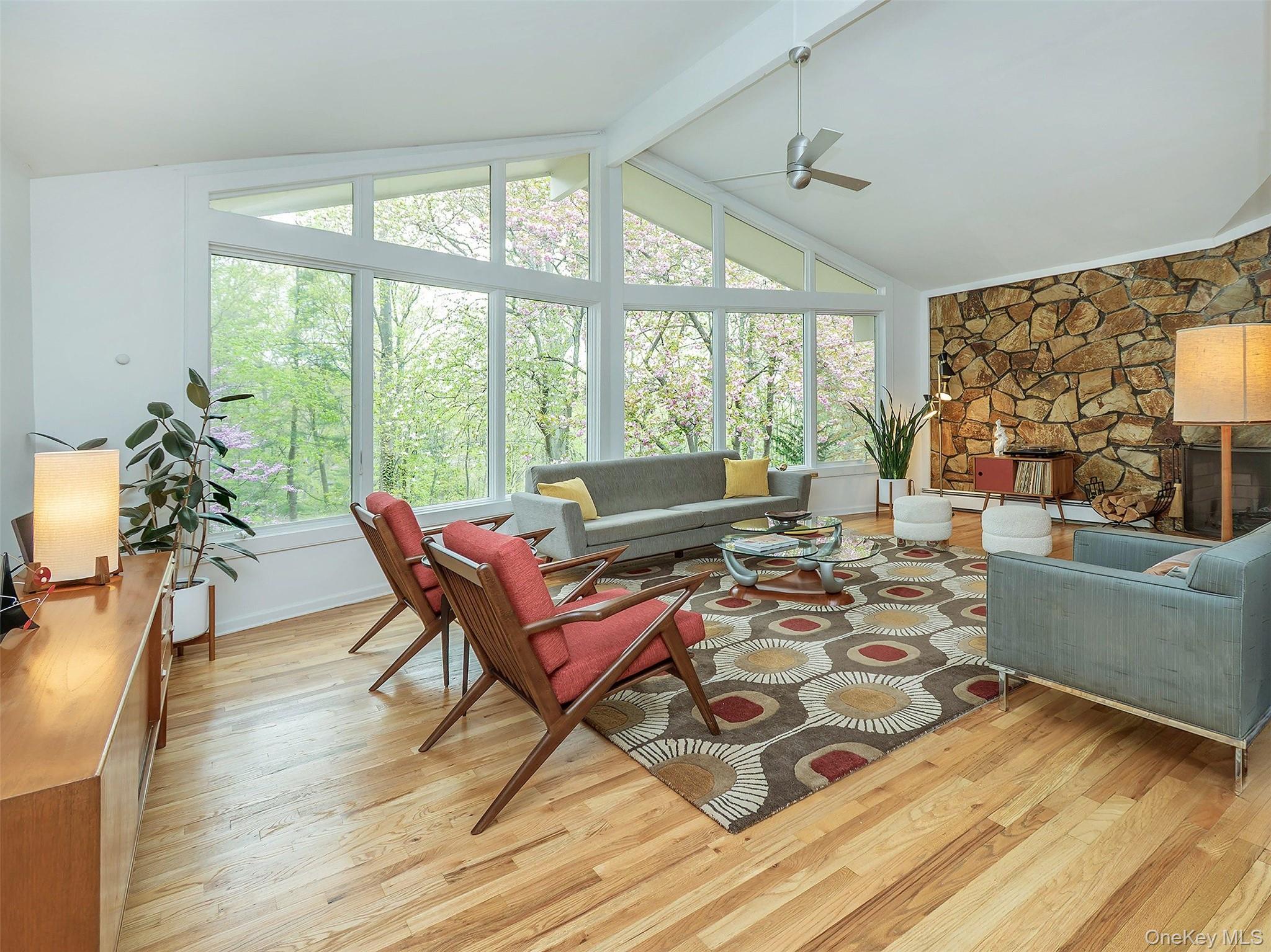 7 SE Road Sands Point, NY 11050 - Photo 10 of 45 a living room with furniture and a large window