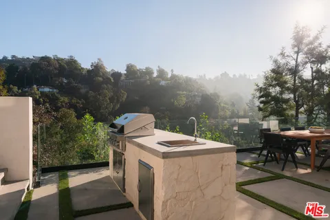 a terrace with a bench and couches