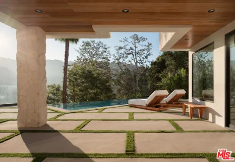 a view of swimming pool with a patio