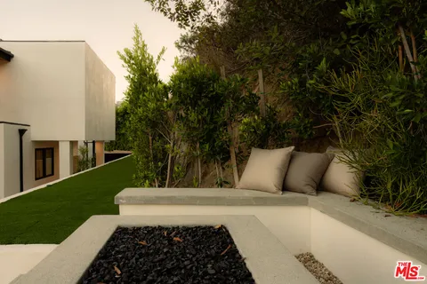 a view of a couches and a table in the patio