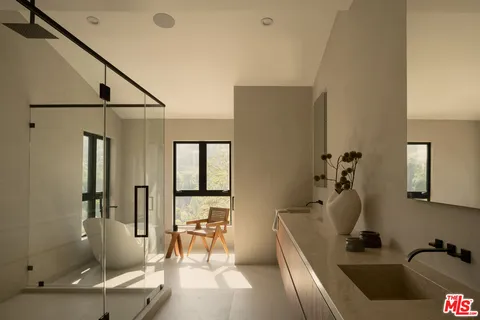 a bathroom with a tub and a shower
