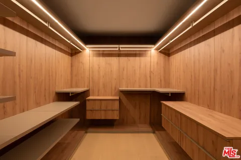 a living room with a large window and a table