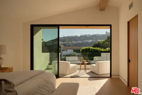 a bathroom with a shower a toilet and sink