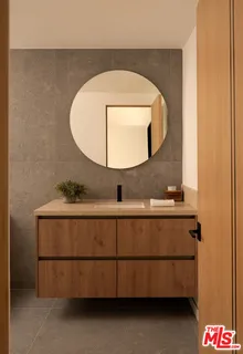 a bedroom with a bed and a mirror