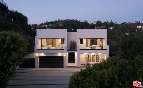 a front view of a house with yard