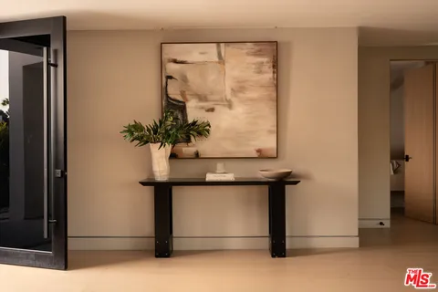 a view of entryway with a flower pot and a table