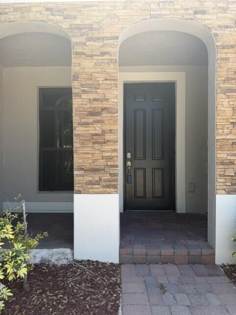 23765 Southwest 118 Avenue, Unit 23765 Homestead, FL 33032 - Photo 3 of 36 a view of front door of a house
