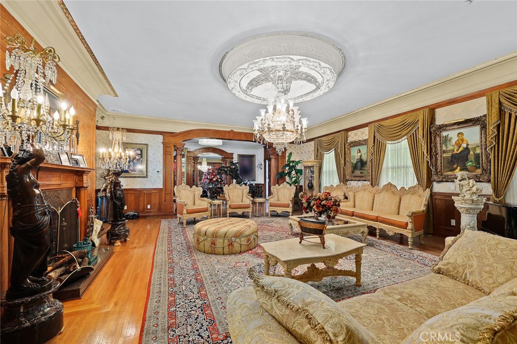 999 Rosalind Road San Marino, CA 91108 - Photo 11 of 70 a living room with fireplace furniture and a chandelier