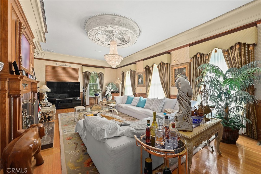 999 Rosalind Road San Marino, CA 91108 - Photo 13 of 70 a living room with furniture a flat screen tv and a floor to ceiling window