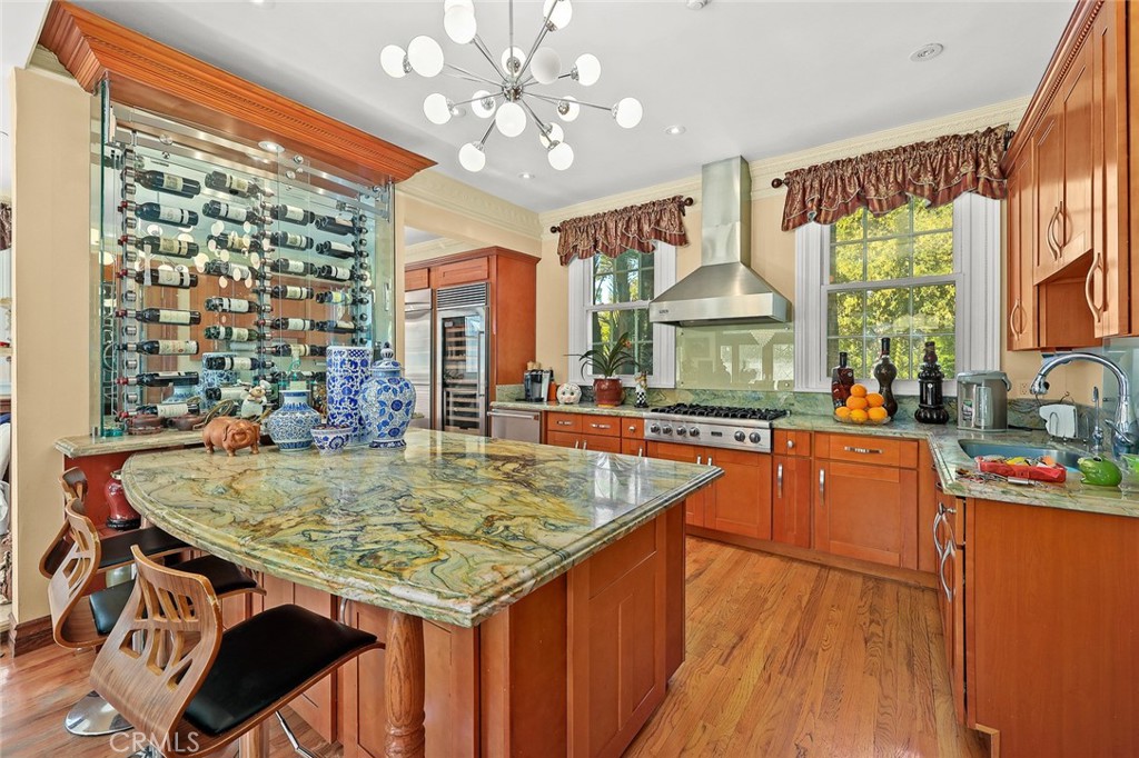 999 Rosalind Road San Marino, CA 91108 - Photo 15 of 70 a kitchen with stainless steel appliances granite countertop a stove and cabinets
