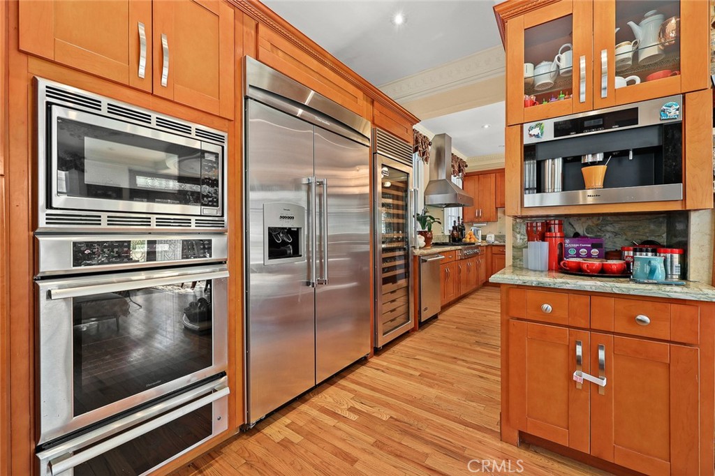 999 Rosalind Road San Marino, CA 91108 - Photo 17 of 70 a kitchen with stainless steel appliances granite countertop a refrigerator and a stove