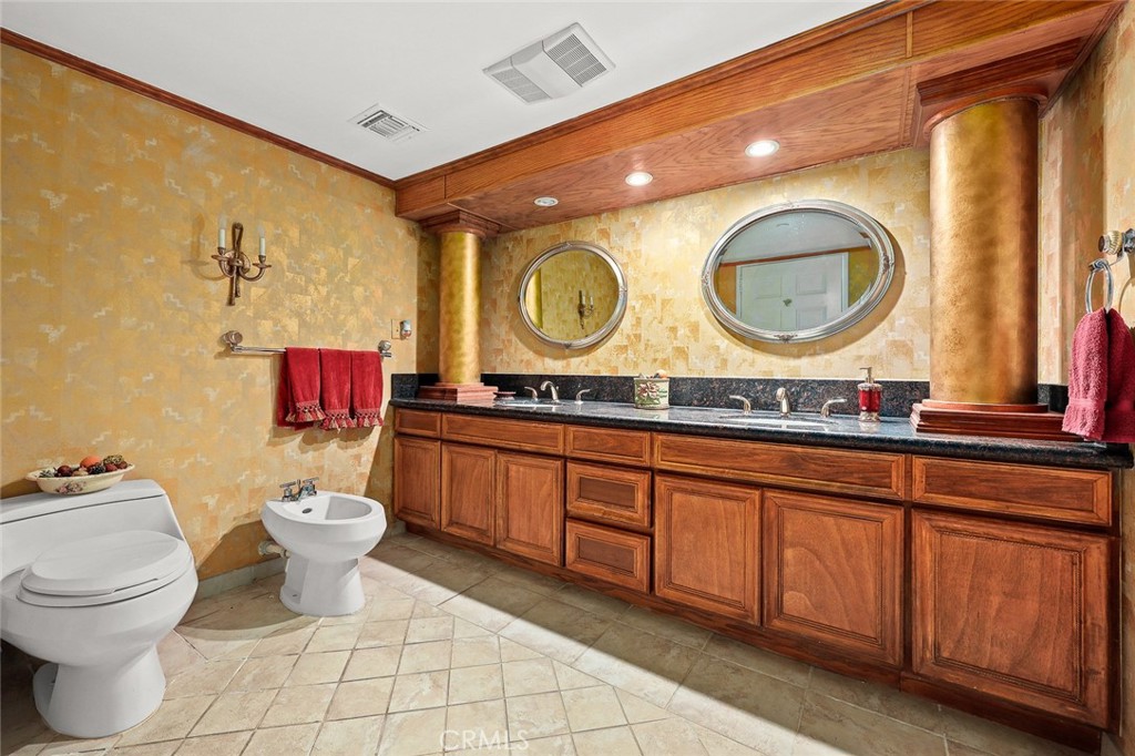 999 Rosalind Road San Marino, CA 91108 - Photo 26 of 70 a bathroom with a toilet a sink and a mirror