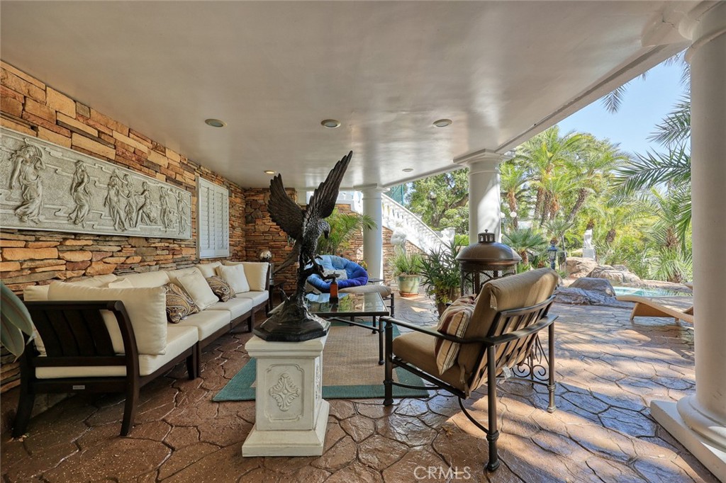 999 Rosalind Road San Marino, CA 91108 - Photo 34 of 70 a living room with patio furniture and a wooden floor
