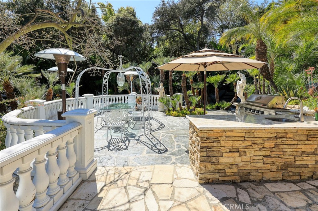 999 Rosalind Road San Marino, CA 91108 - Photo 55 of 70 a view of an outdoor sitting area with an umbrella
