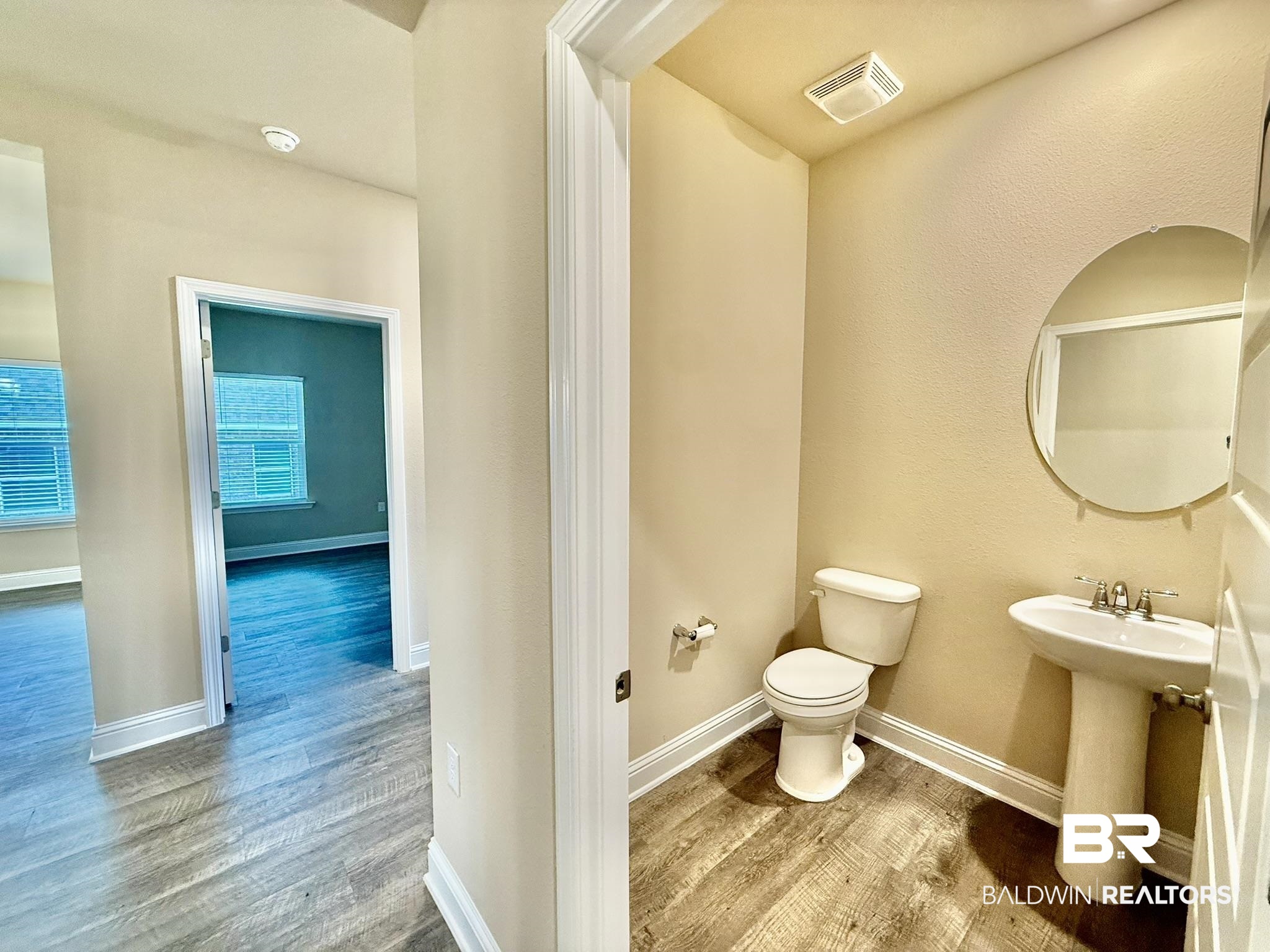 8648 Calverton Street Foley, AL 36535 - Photo 28 of 45 Bathroom featuring wood finished floors and toilet