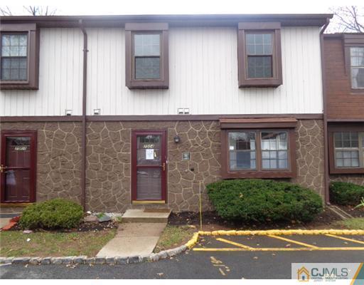 7504 Hana Road Edison, NJ 08817 - Photo 1 of 10 a front view of a house with a yard