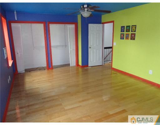 7504 Hana Road Edison, NJ 08817 - Photo 6 of 10 a view of an empty room with a window