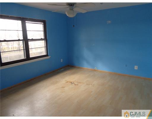 7504 Hana Road Edison, NJ 08817 - Photo 7 of 10 an empty room with a window